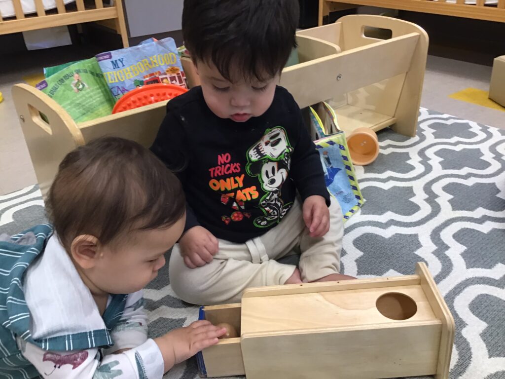 Toddler working with Montessori materials at Edquisitive preschool San Antonio