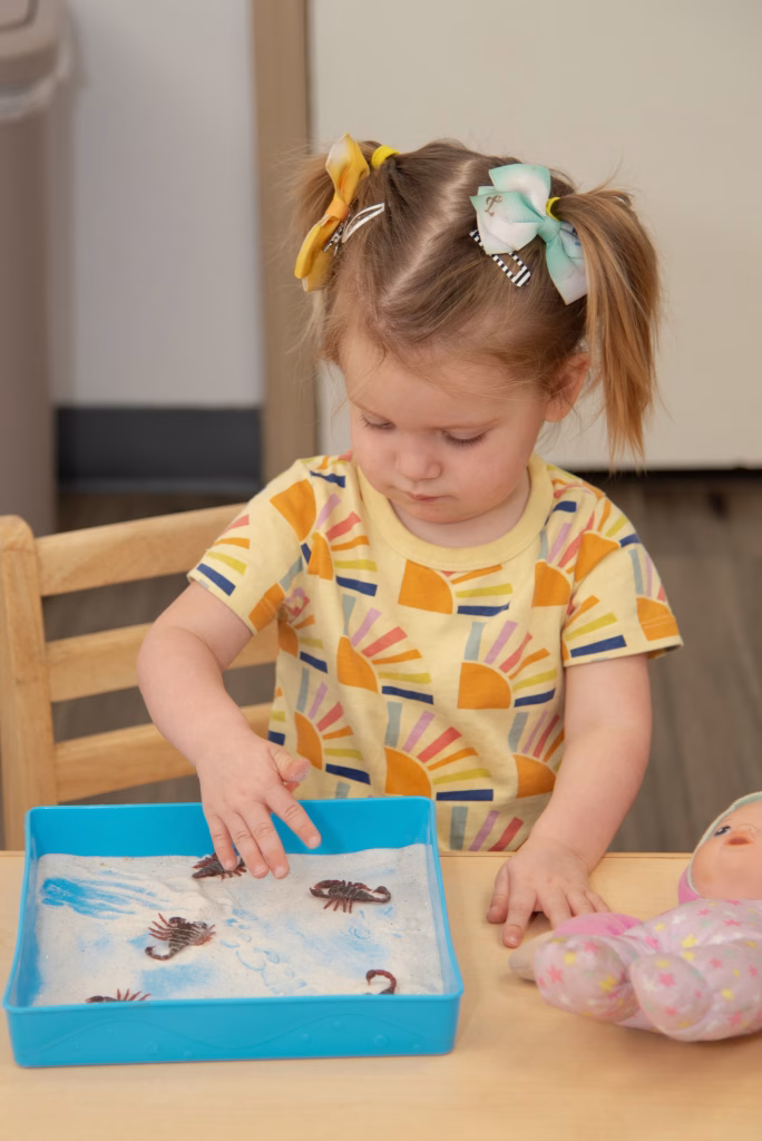 Montessori toddler working independently at Edquisitive in San Antonio