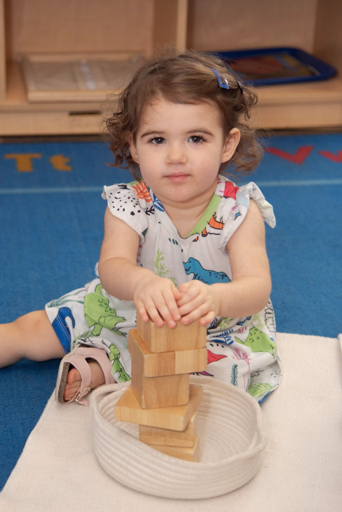 Toddler using Montessori materials at Edquisitive Fair Oaks campus